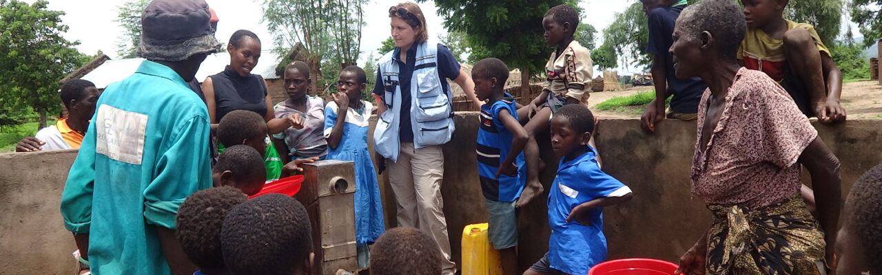 UNDAC Member speaking to community members of Kalima Village.