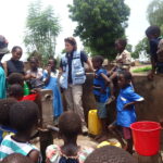 UNDAC Member speaking to community members of Kalima Village.